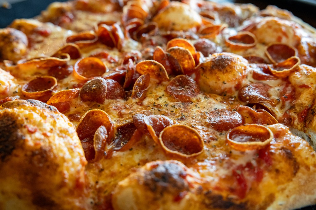 Double pepperoni pizza with crispy curled edges