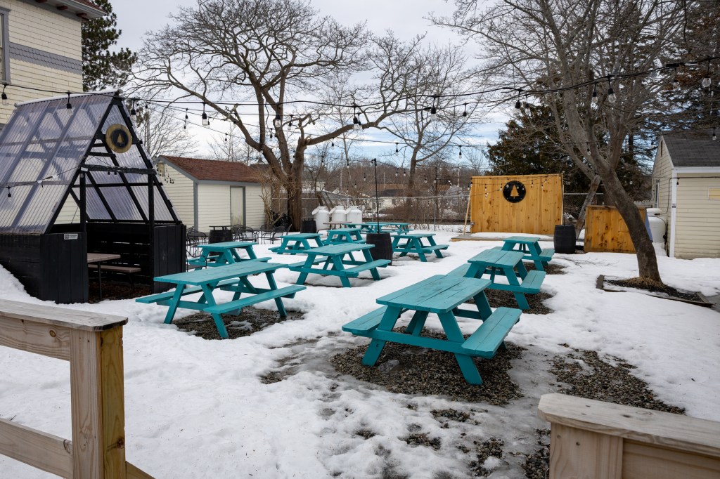 Snow-covered outdoor seating area at Lone Pine