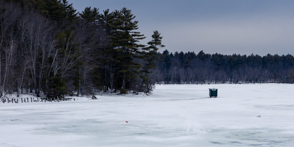 ice fishing shack on frozen Sebago Lake Maine