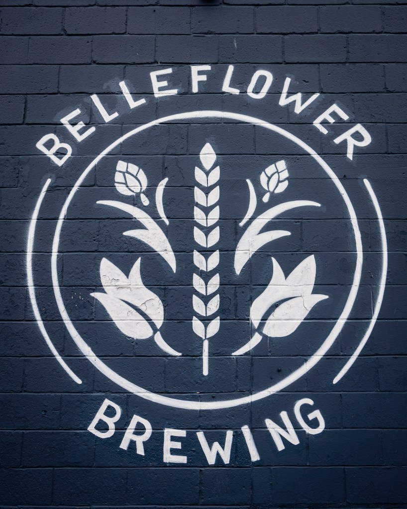 Belleflower Brewing logo painted on exterior wall