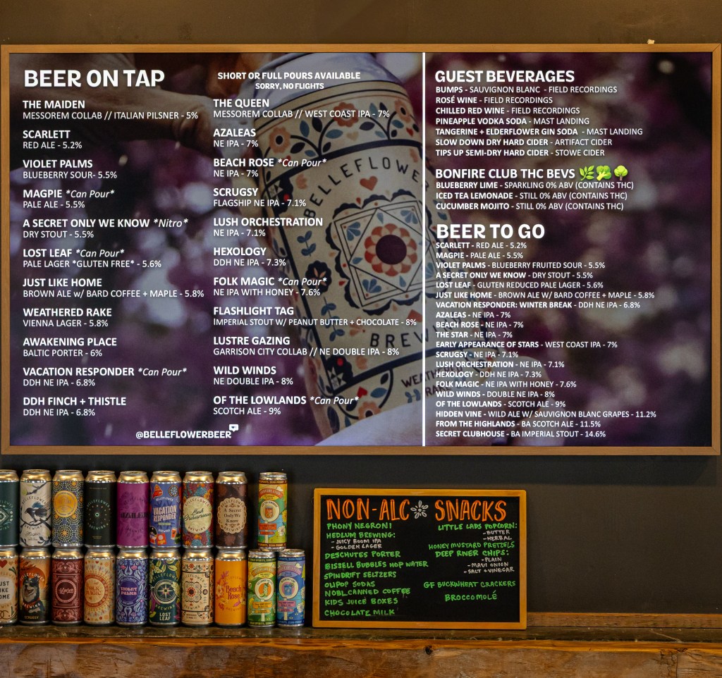 Beer menu board with cans below