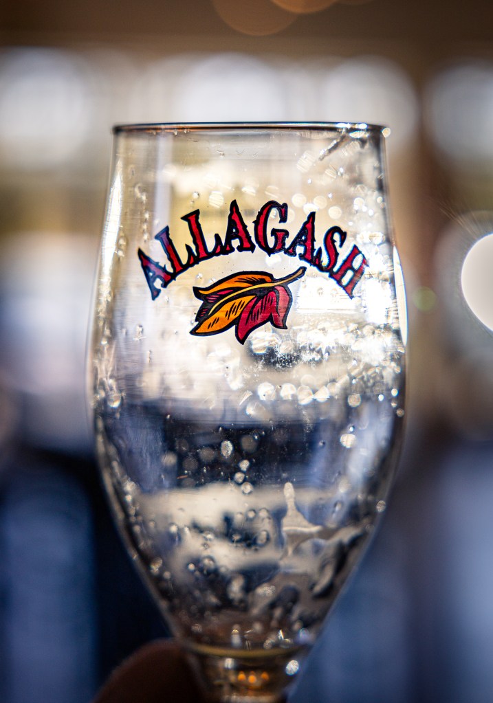 Empty branded Allagash Brewery glass