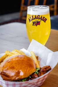 Allagash White beer with sandwich and fries on table