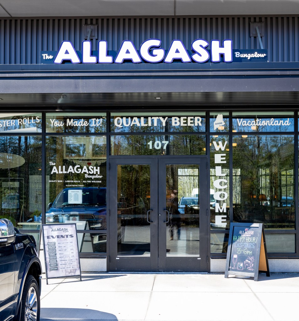 Exterior of Allagash Bungalow in Scarborough Maine with signage and entrance
